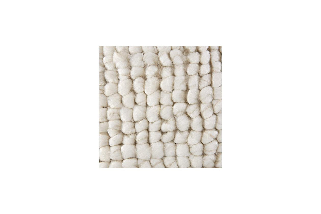 Aavie Ivory Pillow by Ashley at Eve Furniture