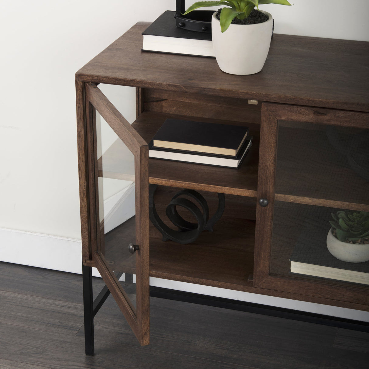 Arelius 36L x 18W x 32H Medium Brown Wood, Black Metal Base w/ 2 Glass Doors Accent Cabinet by Mercana at Eve Furniture