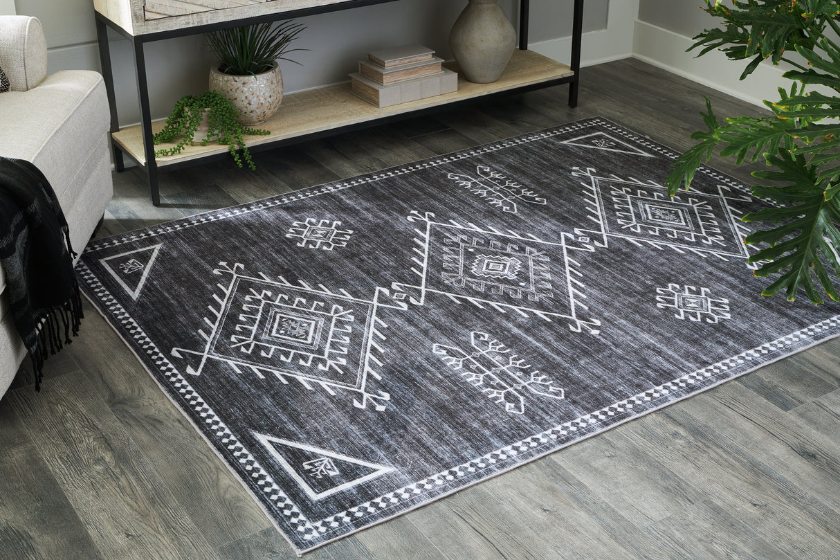 Arloman Black/Cream/Gray 5' x 7' Rug by Ashley at Eve Furniture