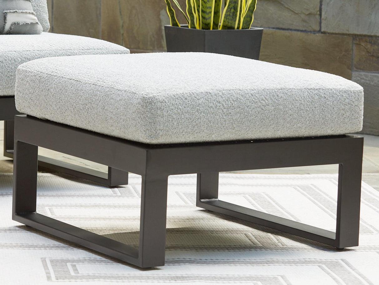 Beachloft Black/Gray Outdoor Ottoman with Cushion by Ashley at Eve Furniture