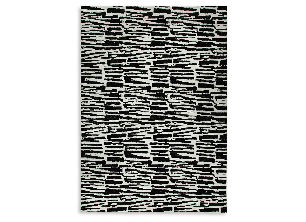 Bramshaw Black/Ivory Extra Large Rug by ASHLEY FURNITURE at Eve Furniture