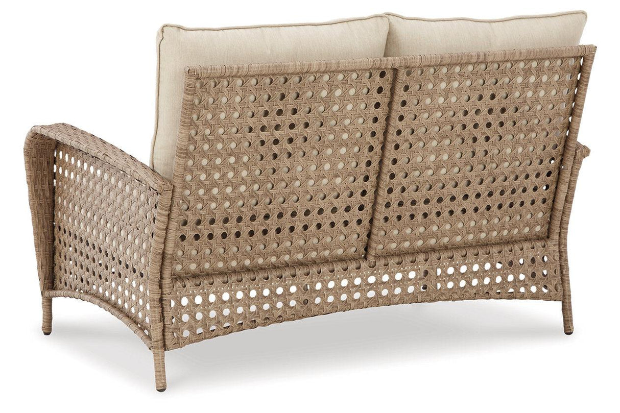 Braylee Driftwood Outdoor Loveseat with Table by Ashley at Eve Furniture