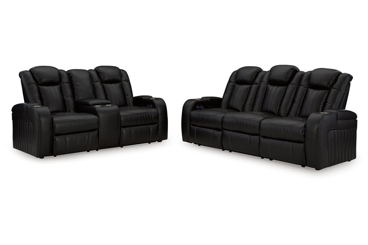 Caveman Den Midnight Dual Power Reclining Sofa and Loveseat by Ashley at Eve Furniture