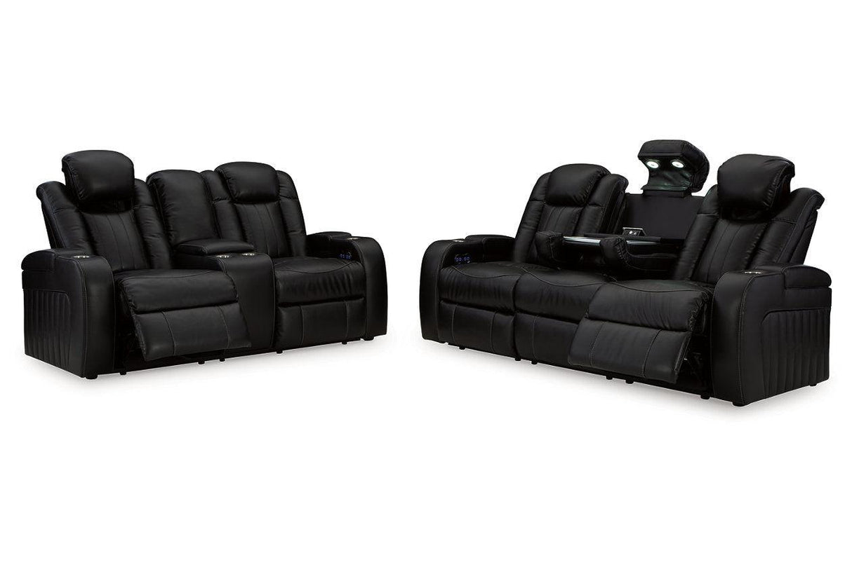 Caveman Den Midnight Dual Power Reclining Sofa and Loveseat by Ashley at Eve Furniture