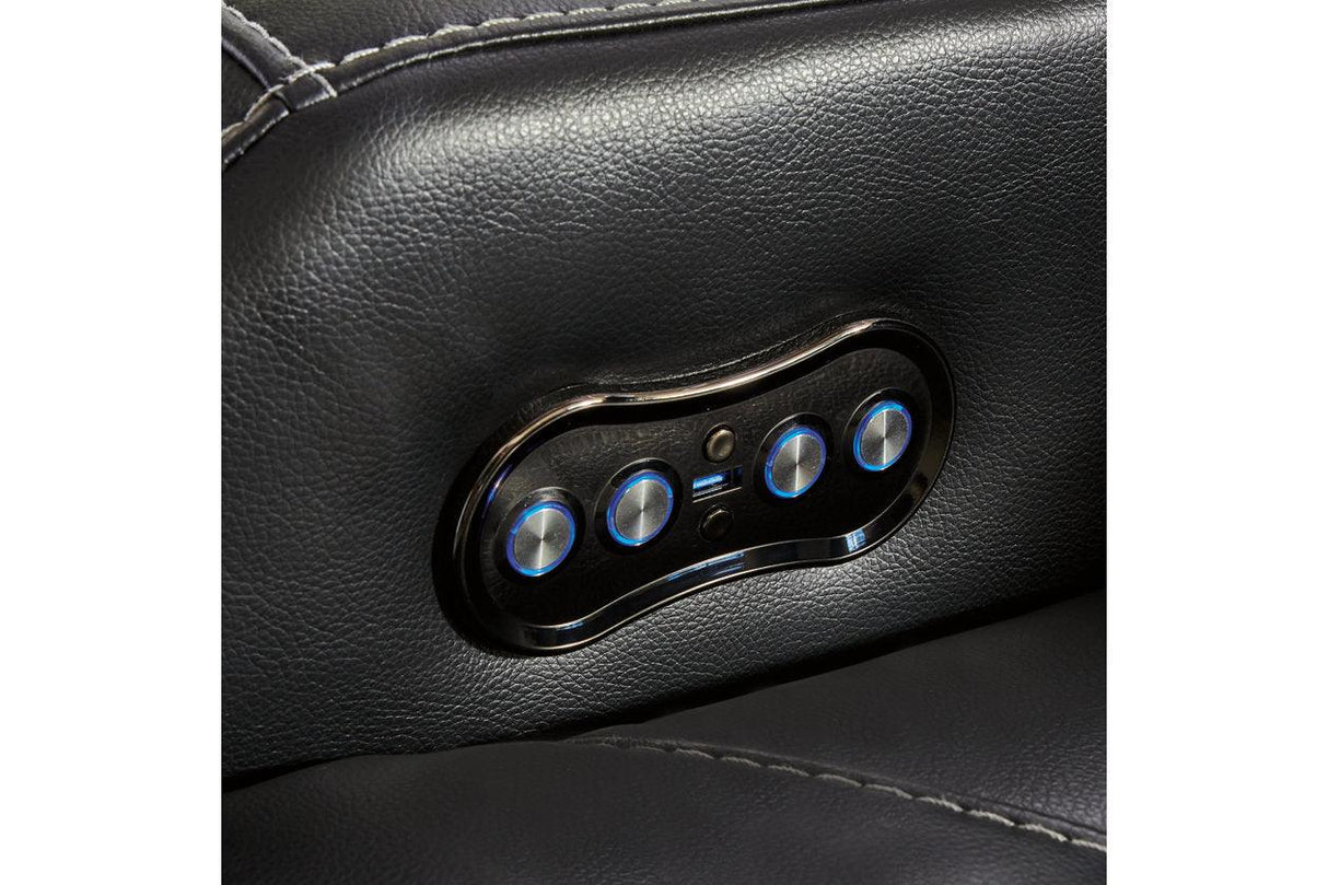 Caveman Den Midnight Dual Power Reclining Sofa and Loveseat by Ashley at Eve Furniture