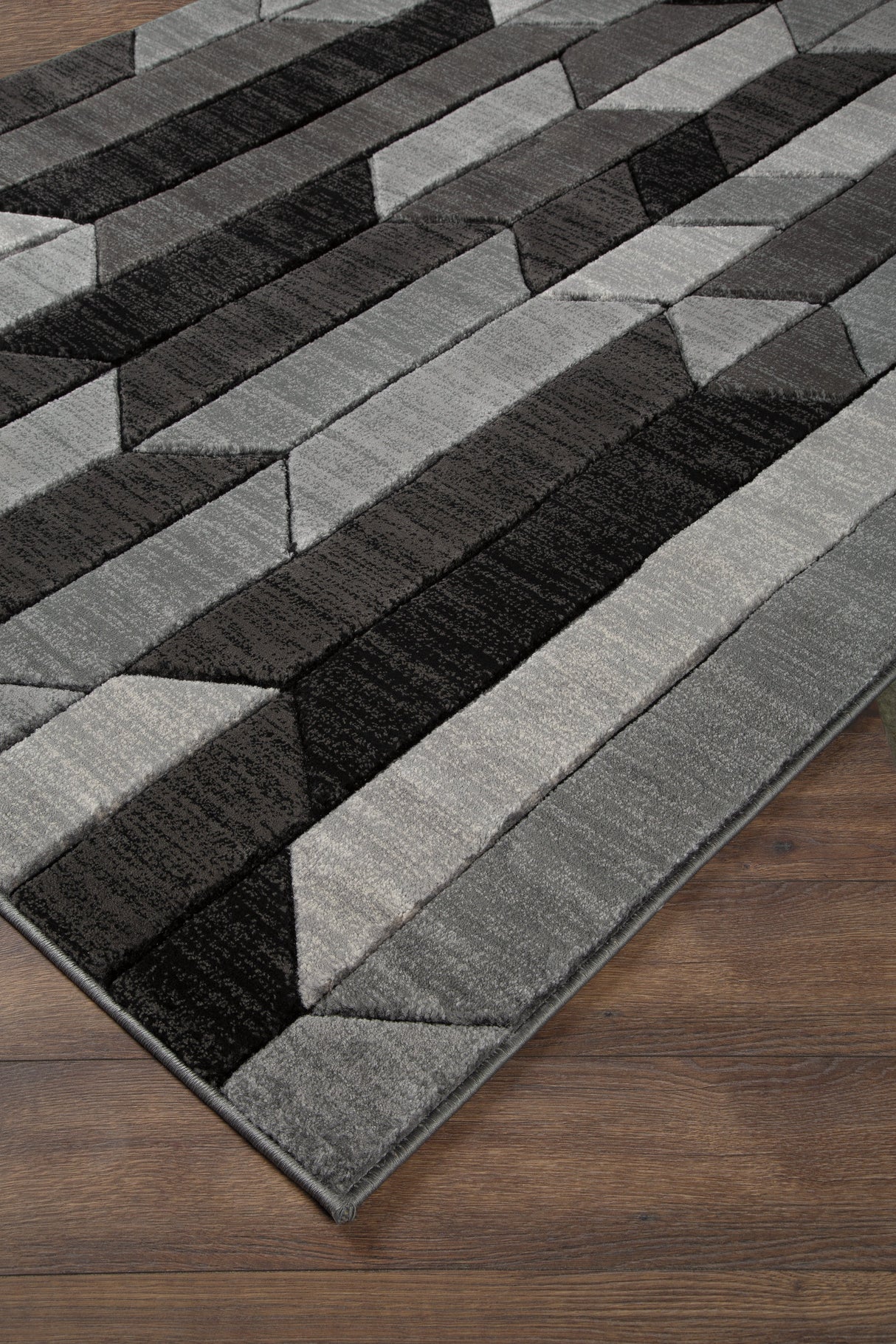 Chayse Black/Gray 6'6" x 9'6" Rug by Ashley at Eve Furniture