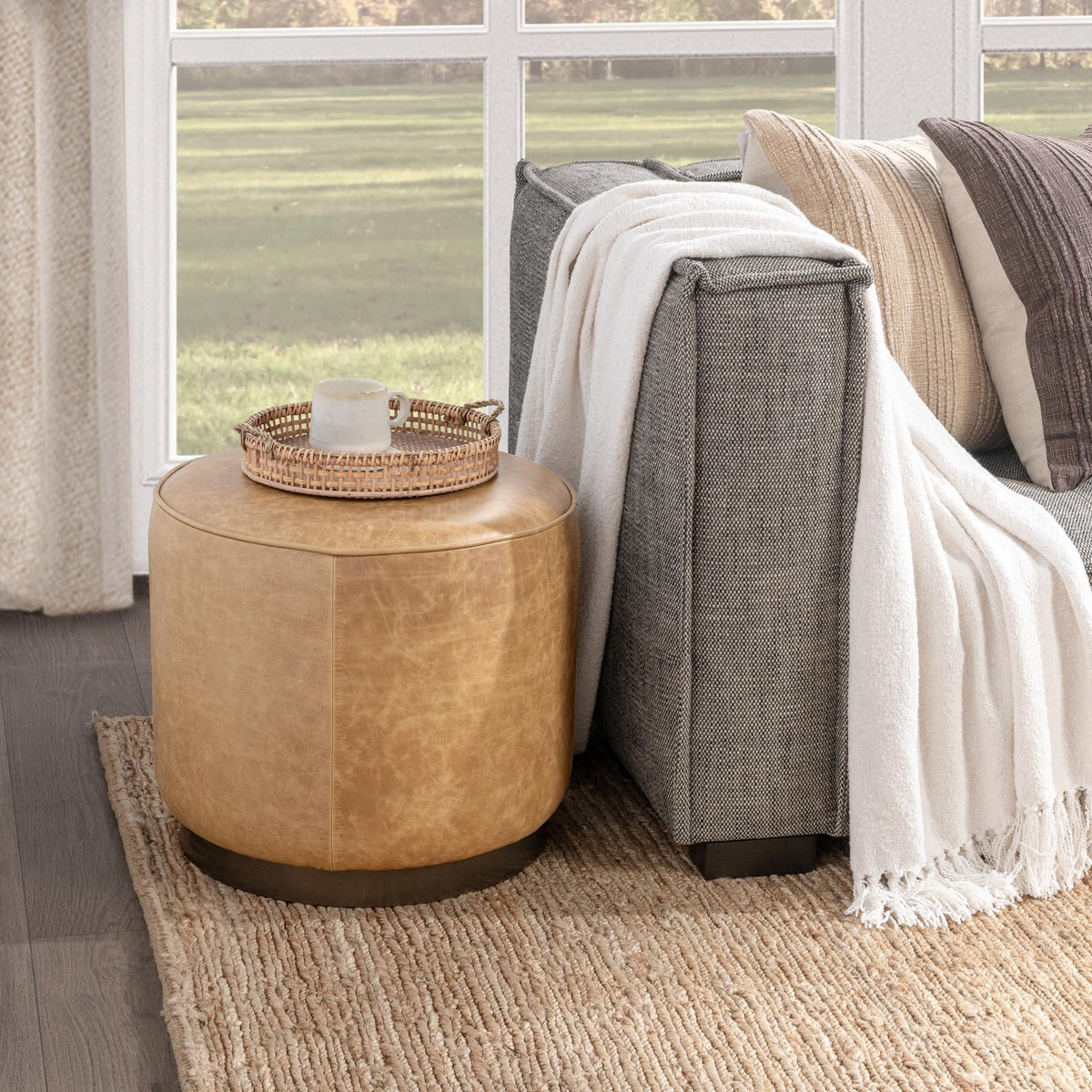Clair Sedona Brown 20" Round Ottoman by Classic Home at Eve Furniture