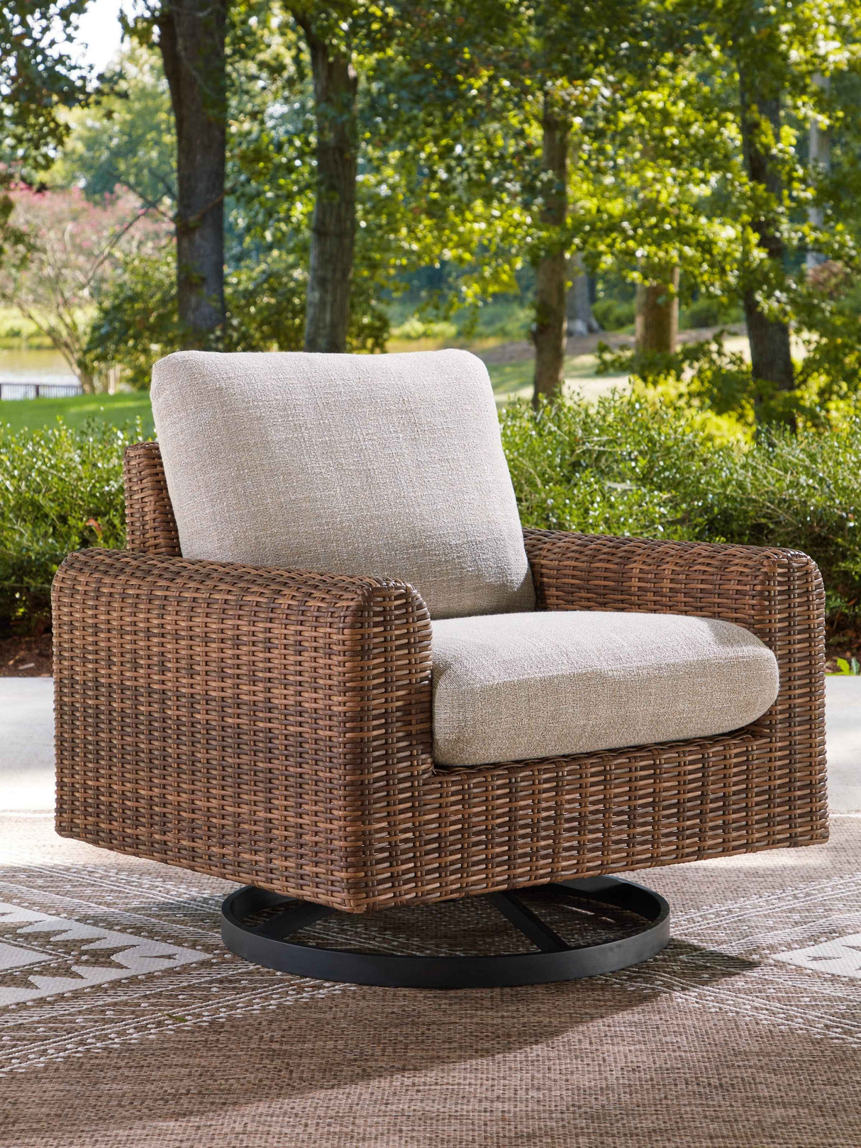 Dolan Creek Gray/Brown Swivel Lounge w/ Cushion by Ashley at Eve Furniture
