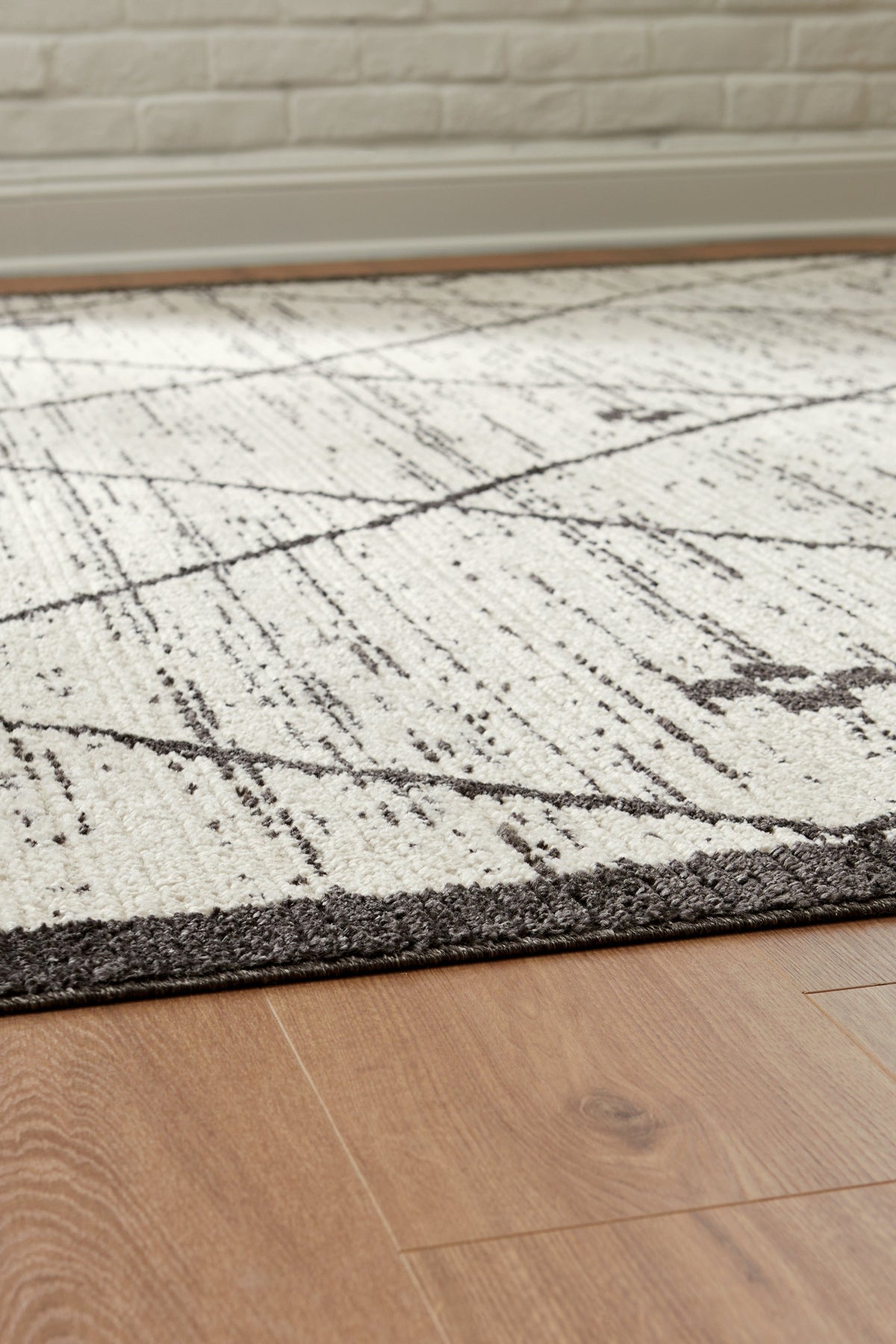 Fenriston Cream/Black Large Rug by Ashley at Eve Furniture