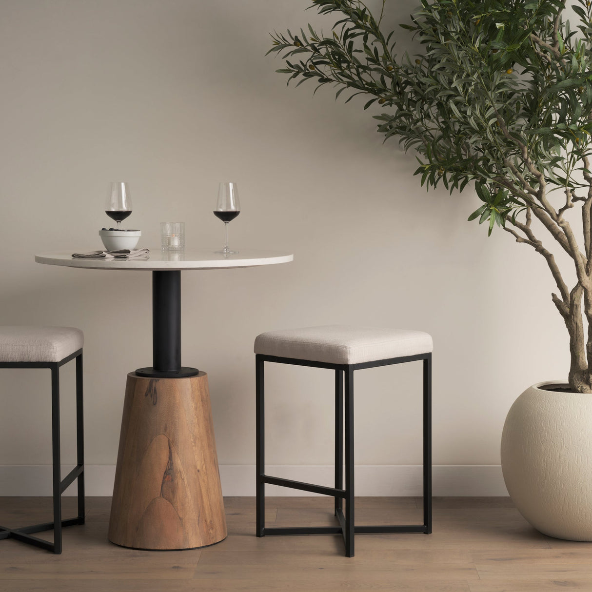 Frodo 26.4H Seat Height White Fabric Seat Black Metal Base Stool by Mercana at Eve Furniture
