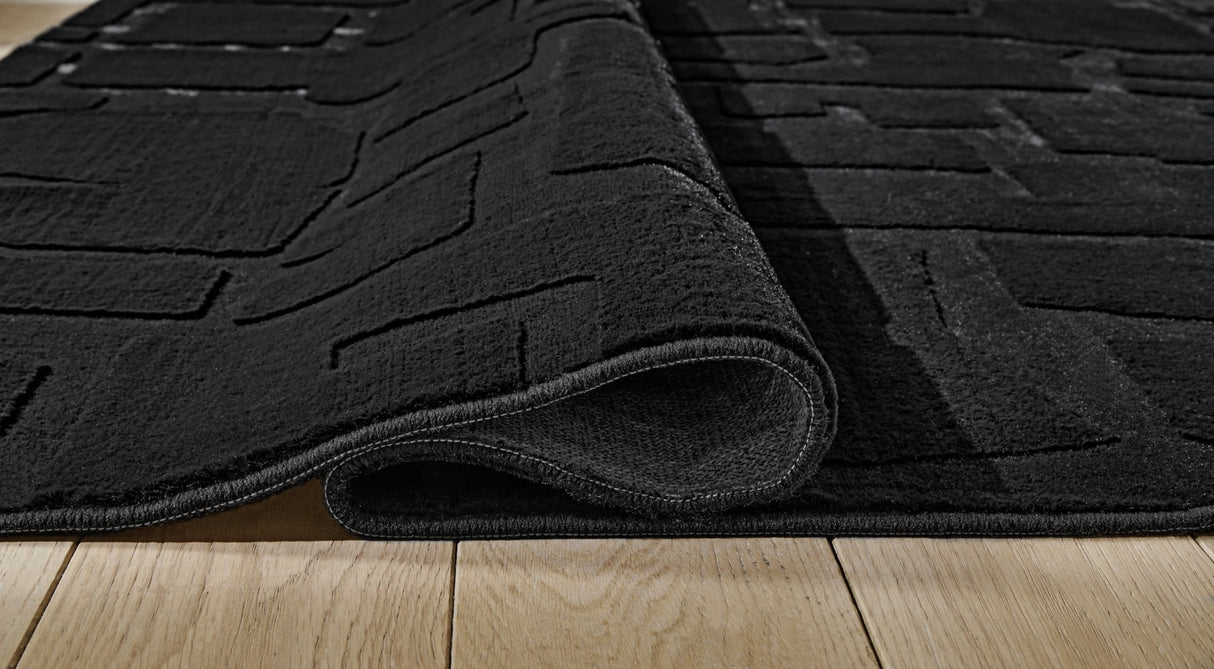 Gibbswell Black Washable Medium Rug by Ashley at Eve Furniture