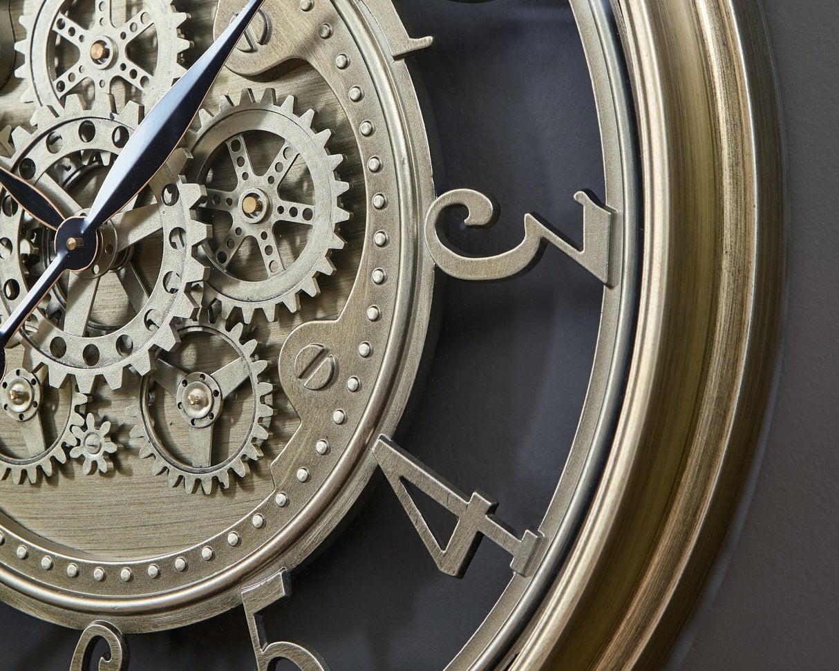 Gilover Champagne Finish Wall Clock by Ashley at Eve Furniture