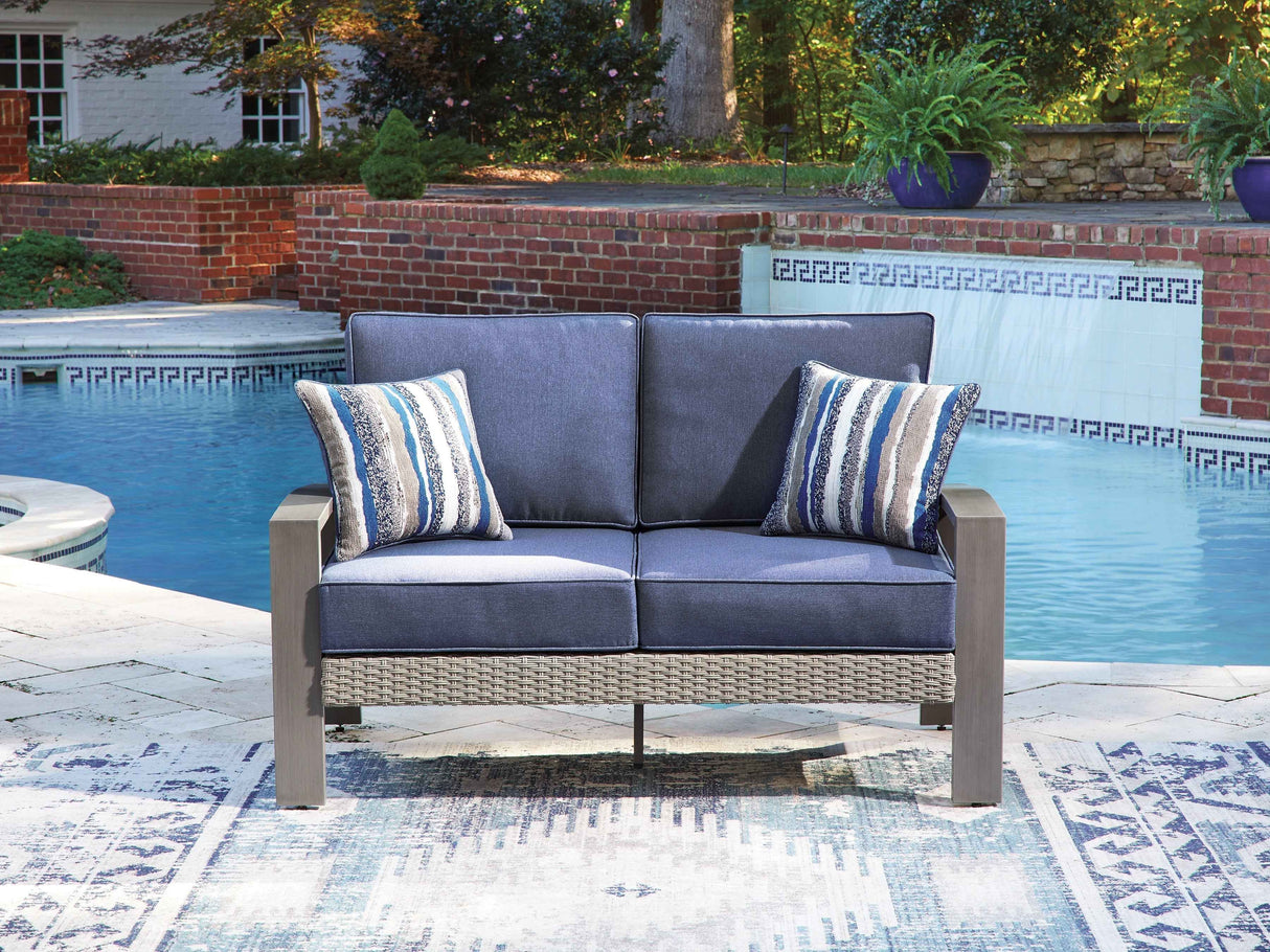 Half Moon Beach Blue/Gray Outdoor Loveseat with Cushion by Ashley at Eve Furniture