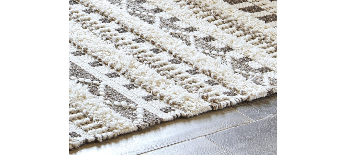 Karalee Ivory/Brown 5' x 7' Rug by Ashley at Eve Furniture