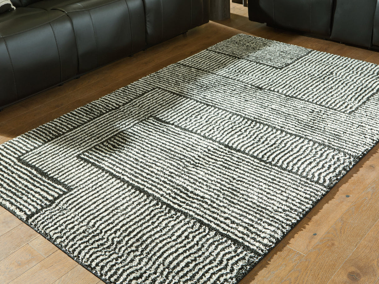 Kurtmen Black/Ivory Medium Rug by Ashley at Eve Furniture