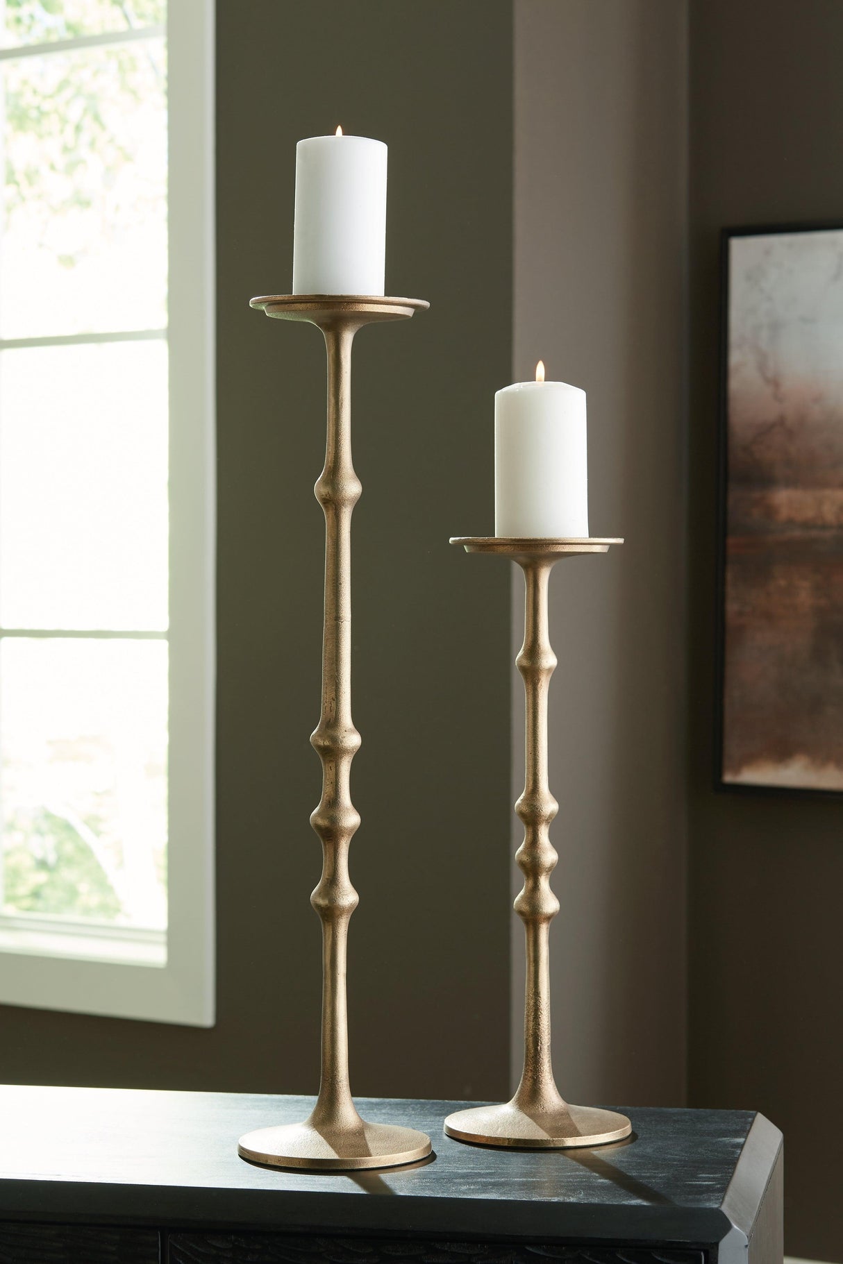 Larwick Antique Brass Finish Candle Holder by Ashley at Eve Furniture