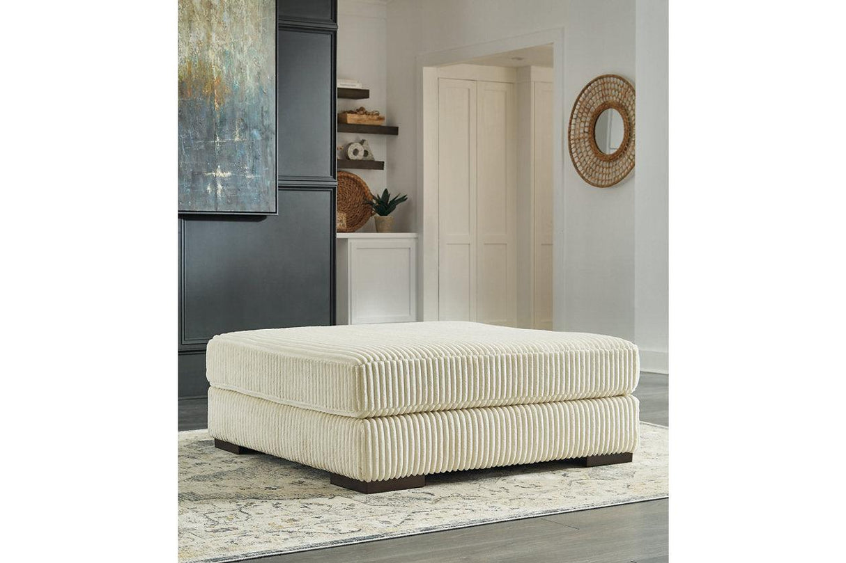 Lindyn Ivory Oversized Accent Ottoman by Ashley at Eve Furniture