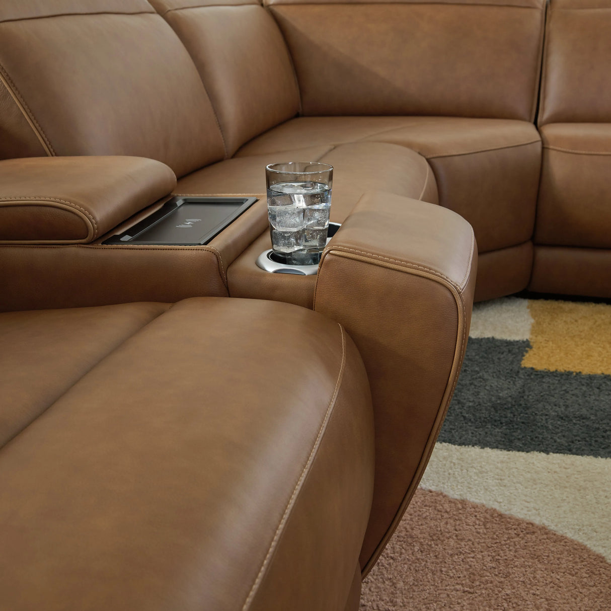Magic Man Caramel 6-Piece Dual Power Leather Reclining Modular Sectional with Console by Ashley at Eve Furniture