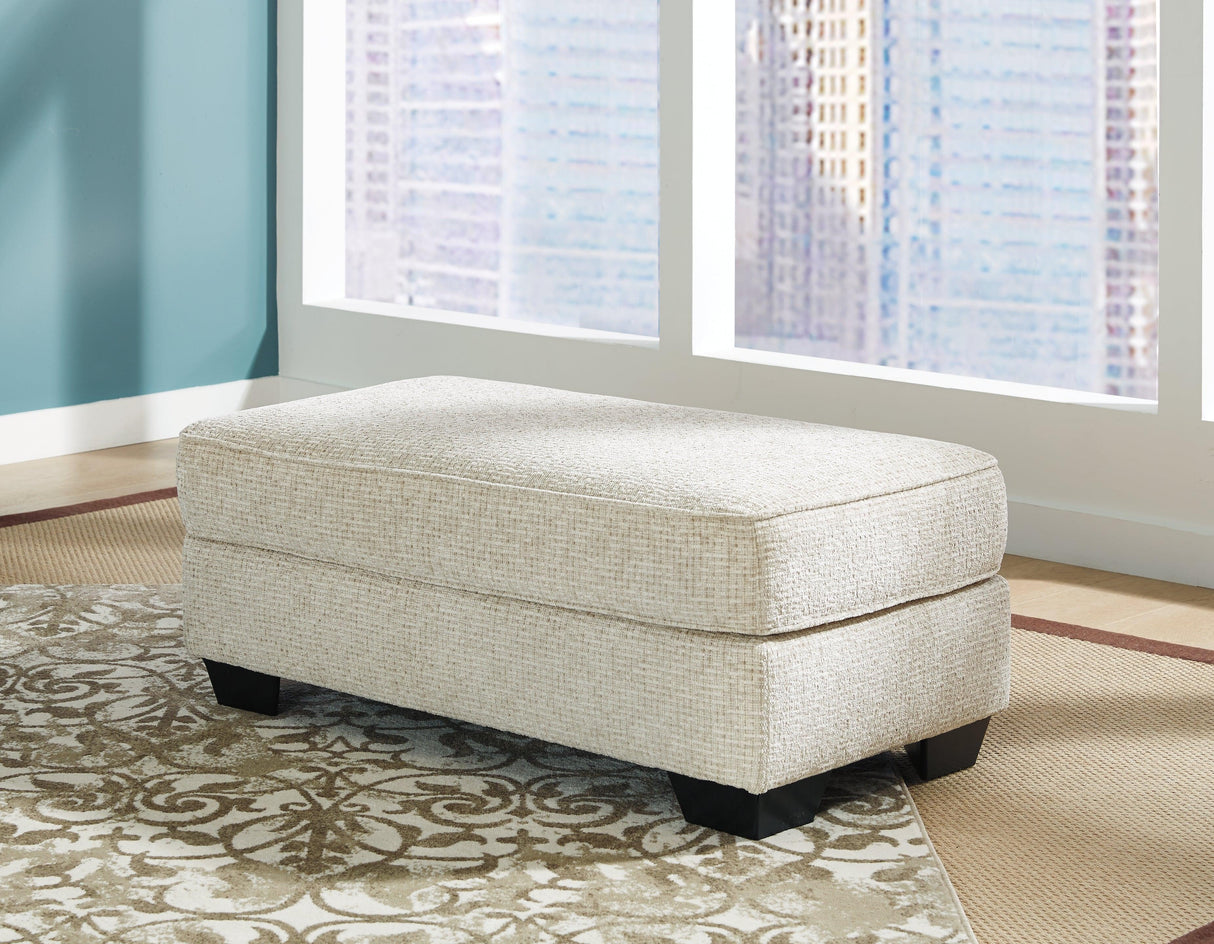 Monaghan Sandstone Ottoman by Ashley at Eve Furniture
