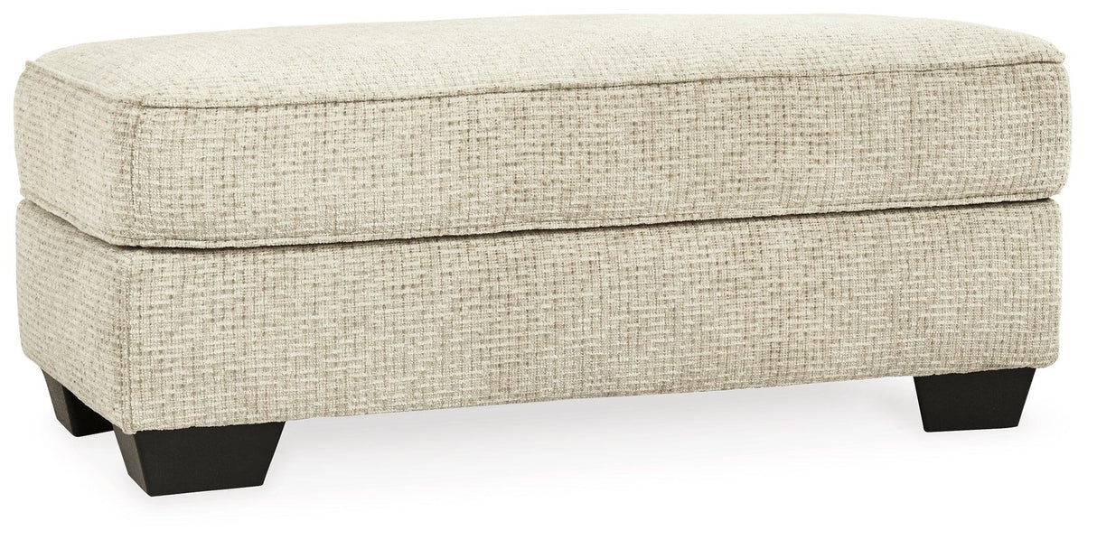 Monaghan Sandstone Ottoman by Ashley at Eve Furniture
