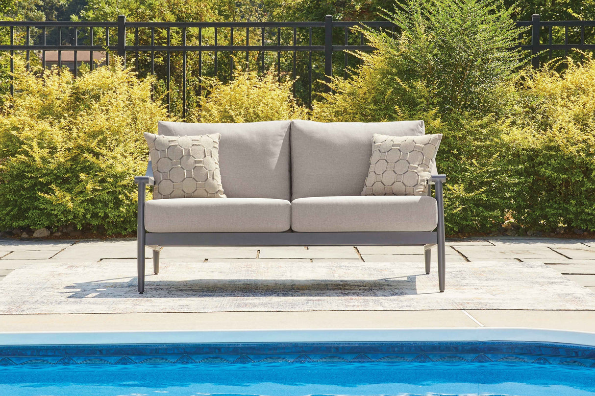 Ocean Beach Gray Outdoor Loveseat with Cushion by Ashley at Eve Furniture