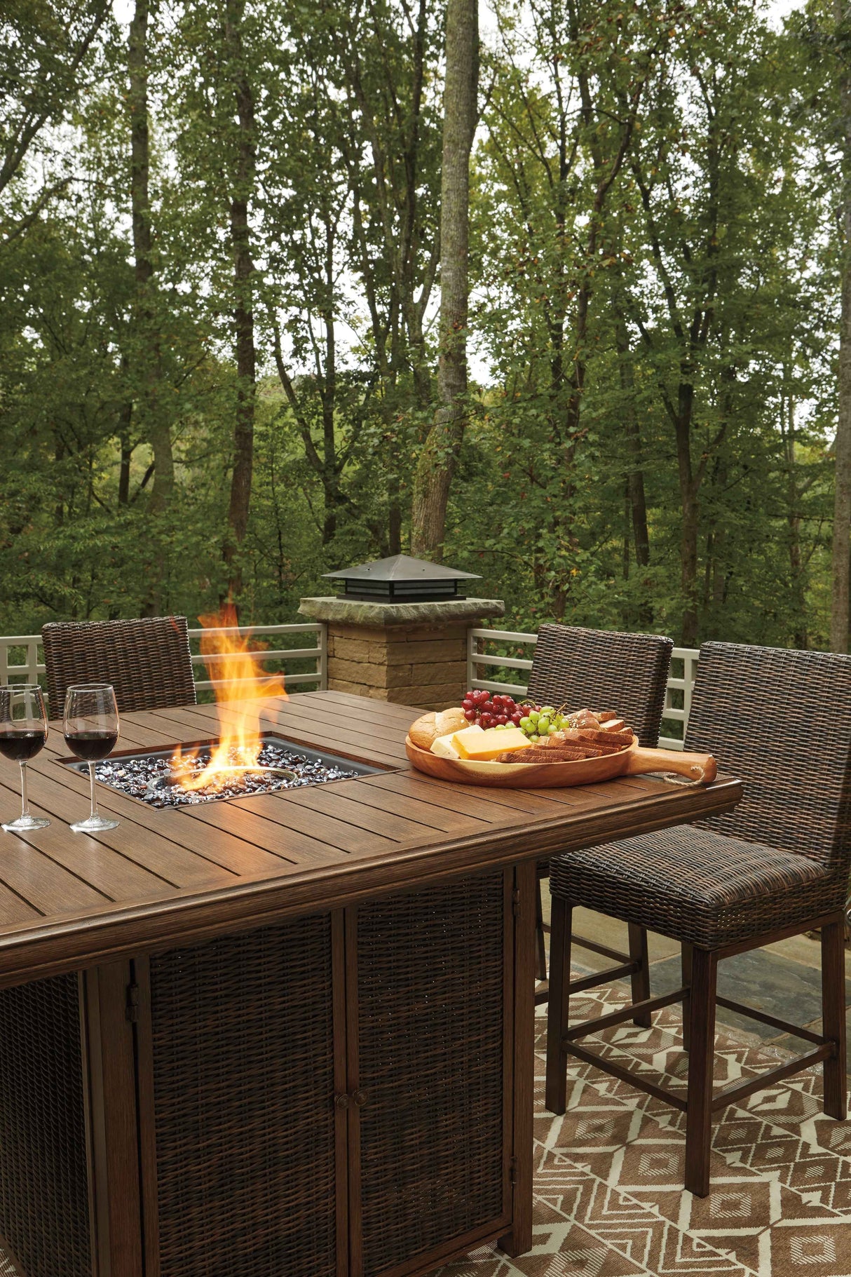Paradise Trail Medium Brown Outdoor Bar Fire Pit Table with 6 Barstools by Ashley at Eve Furniture