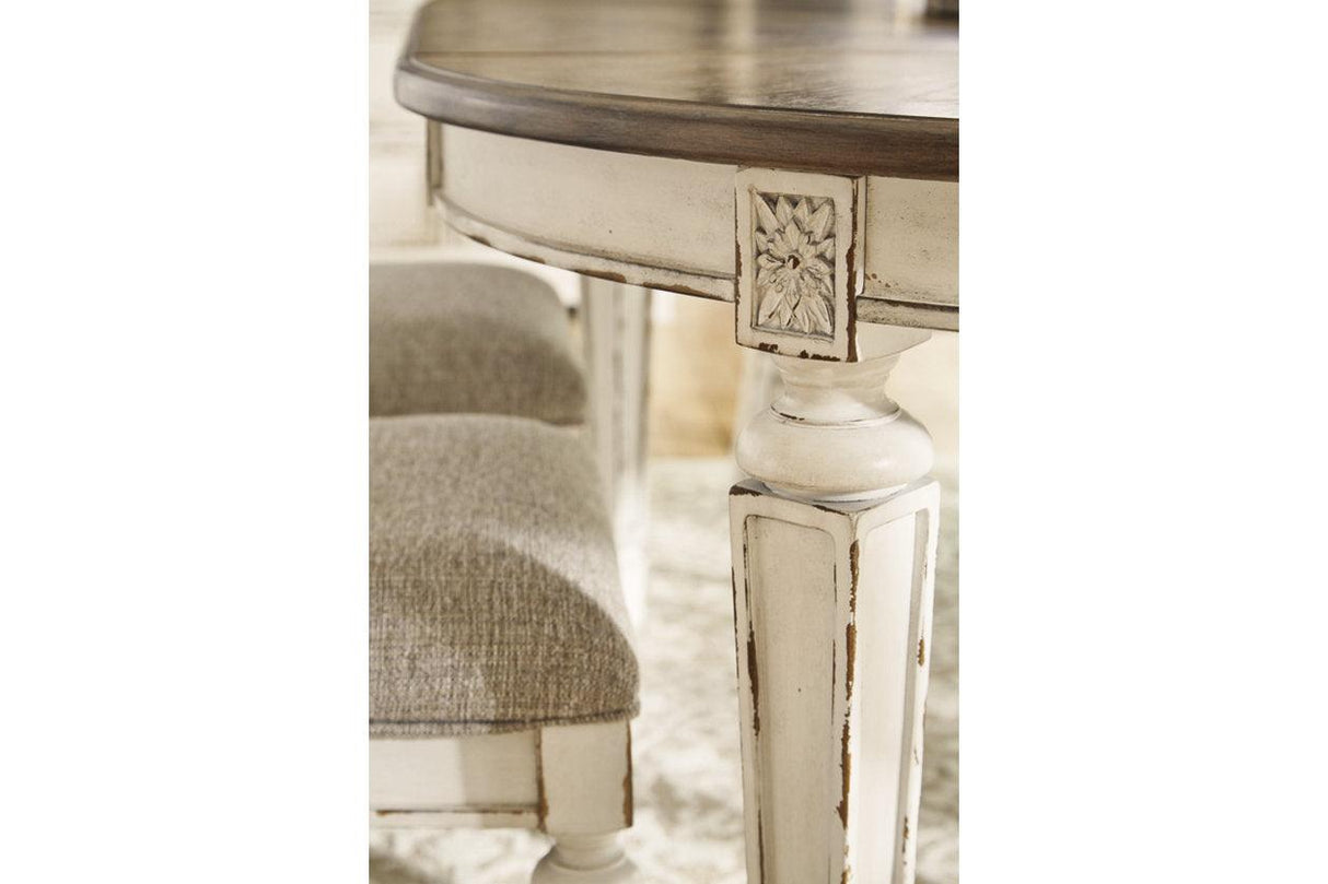 Realyn Chipped White Oval Dining Extension Table by Ashley at Eve Furniture