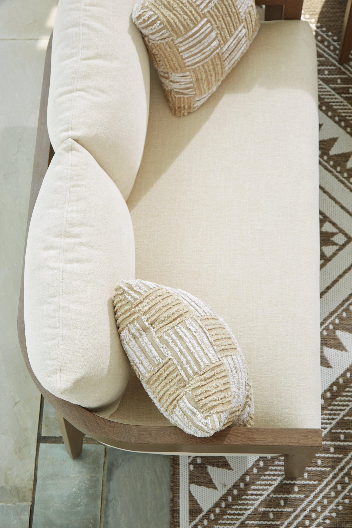 Serene Bay Dark Brown/White Outdoor Loveseat with Cushion by Ashley at Eve Furniture