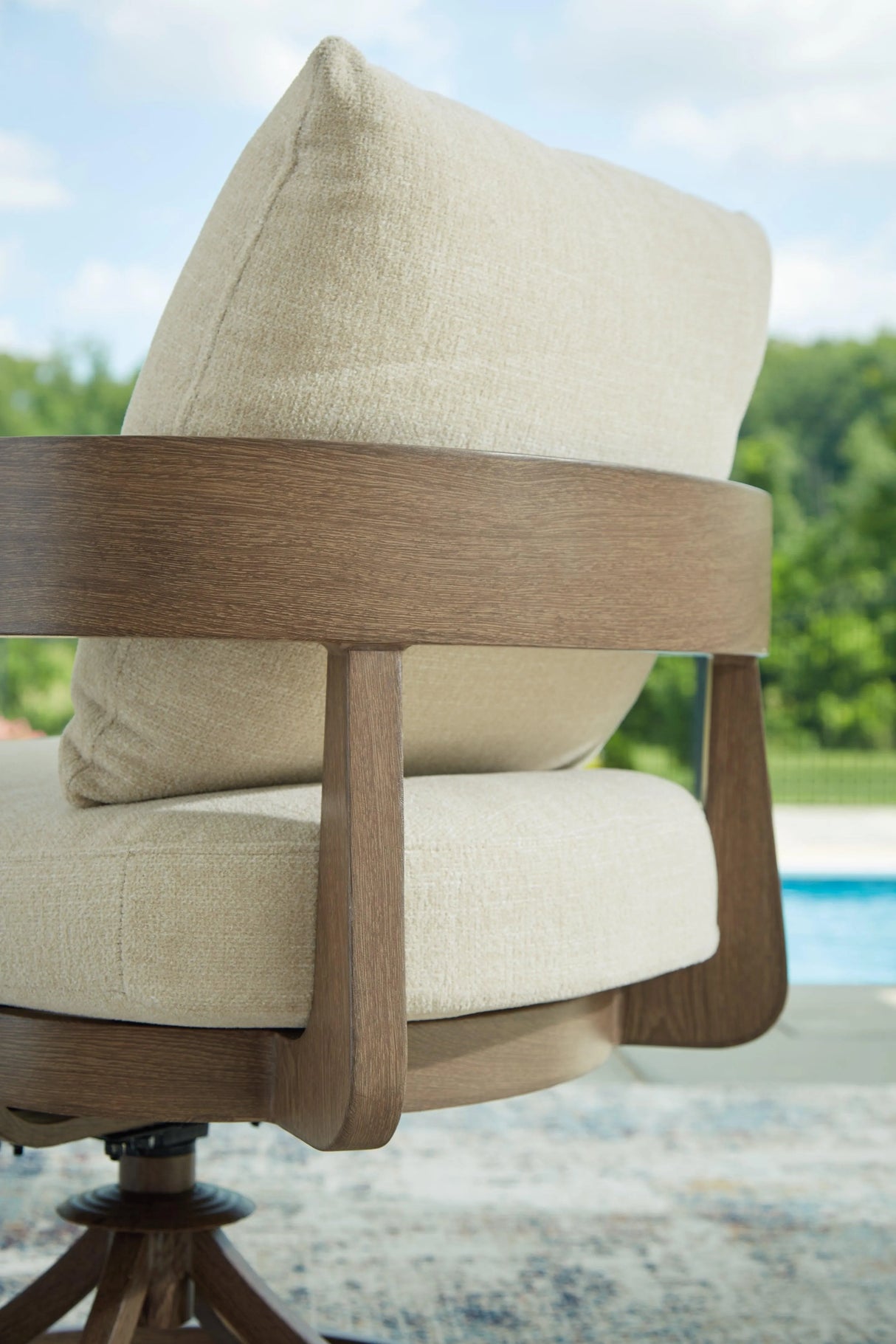 Serene Bay Dark Brown/White Outdoor Swivel Dining Chair with Cushion by Ashley at Eve Furniture