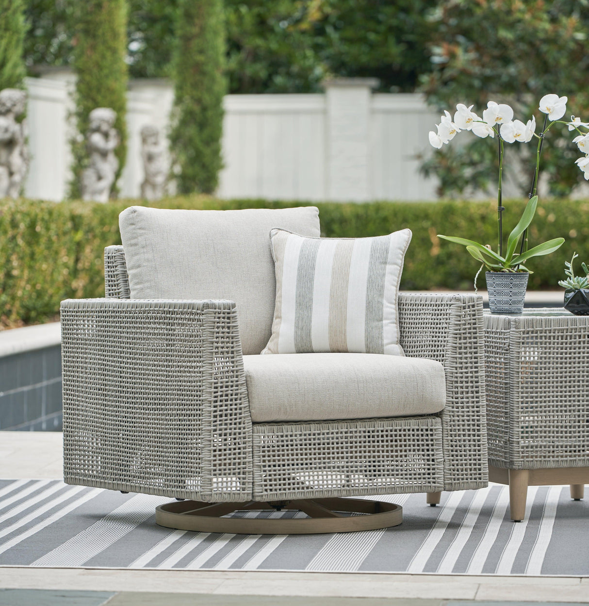Seton Creek Gray Outdoor Swivel Lounge with Cushion by Ashley at Eve Furniture