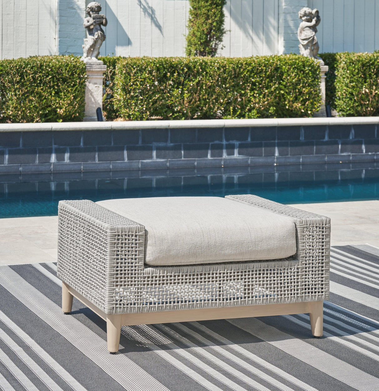 Seton Creek Gray Outdoor Ottoman with Cushion by Ashley at Eve Furniture