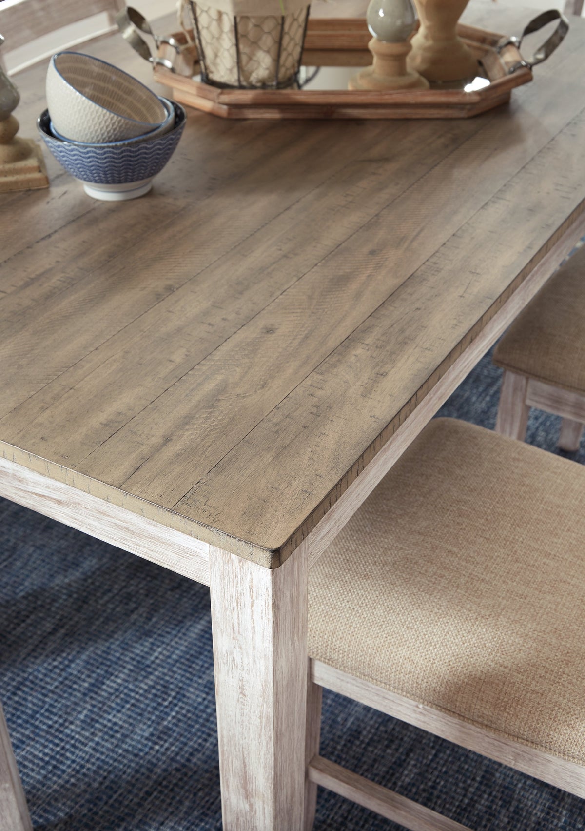 Skempton White/Light Brown Counter Height Dining Table and 4 Barstools by Ashley at Eve Furniture