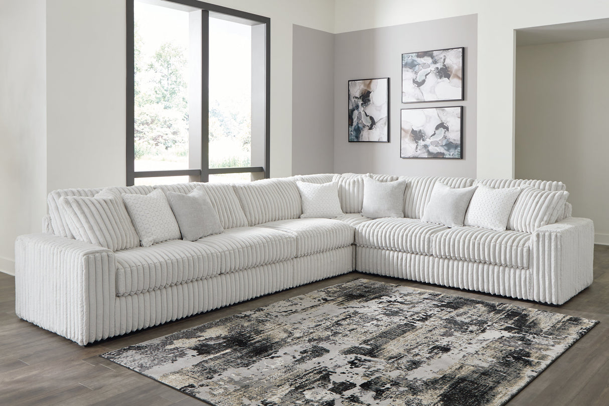 Stupendous 4-Piece Sectional with Ottoman in Alloy by Ashley at Eve Furniture