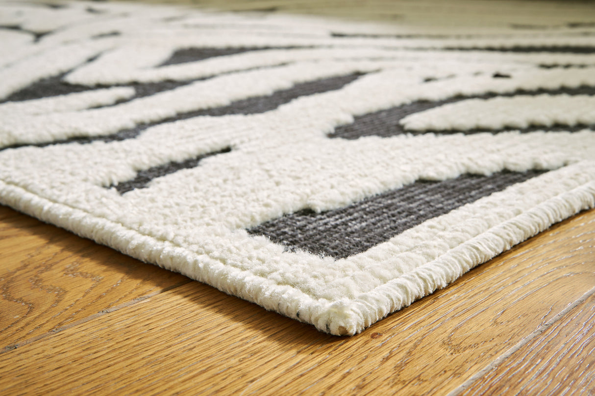 Thomwith Black/Ivory Large Rug by Ashley at Eve Furniture