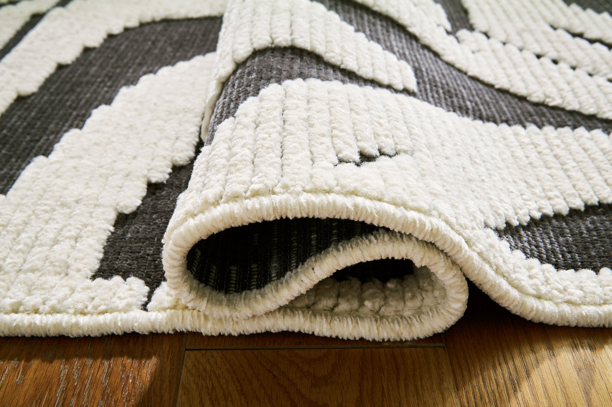 Thomwith Black/Ivory Large Rug by Ashley at Eve Furniture