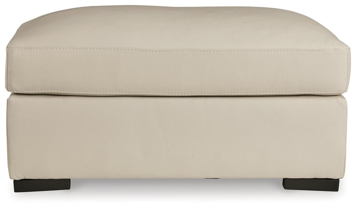 Tresure Trove Almond Ottoman by Ashley at Eve Furniture