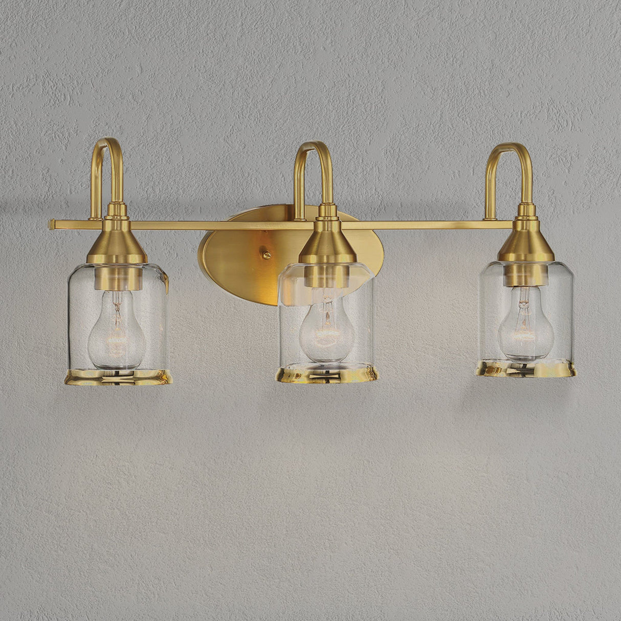 Twilight Three Lights Brushed Gold Contemporary Vanity Light 22"W × 10"H × 7.48"E with Clear Glass by Ashcroft Furniture at Eve Furniture