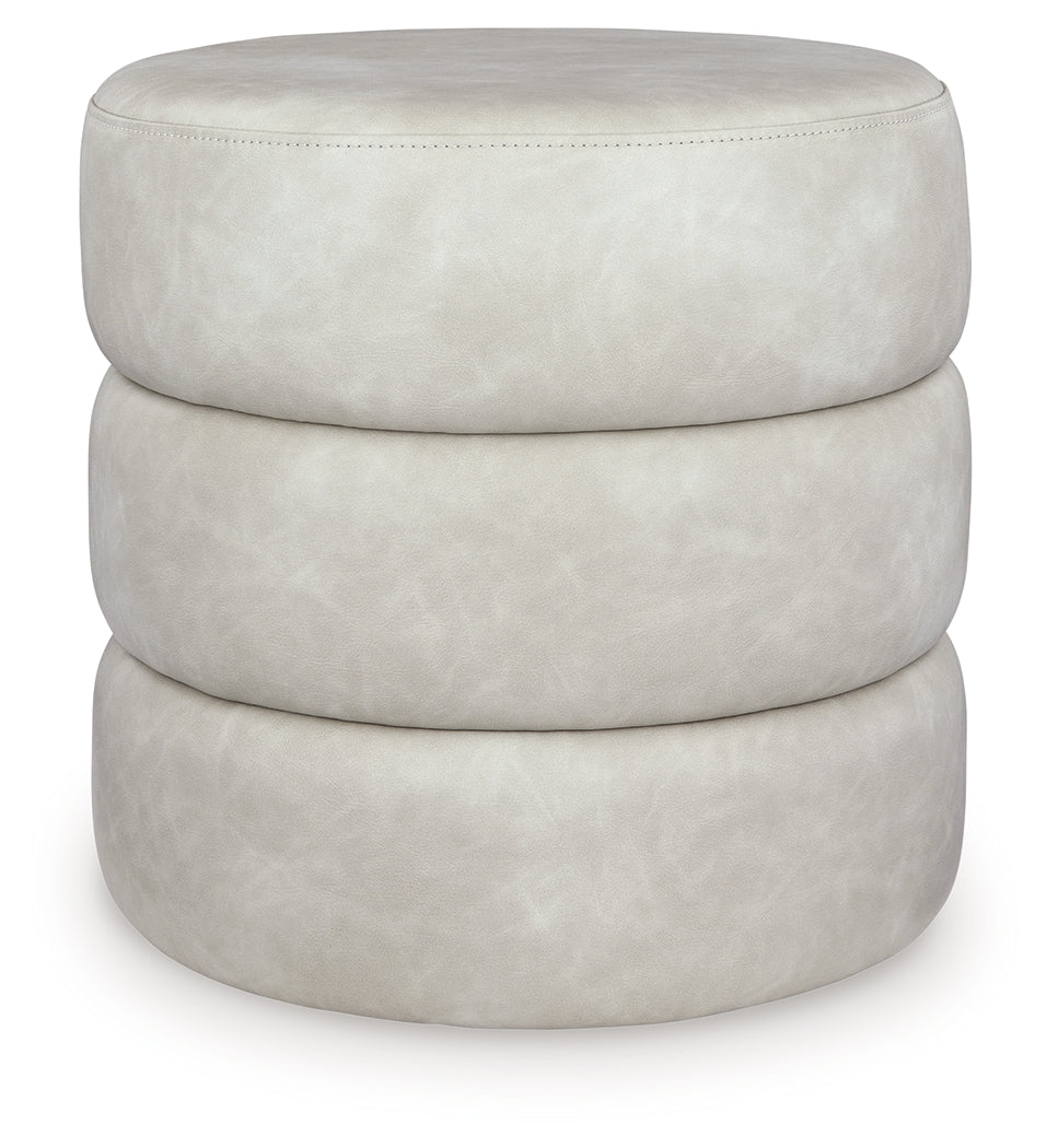Ummi Bone Swivel Accent Ottoman by Ashley at Eve Furniture