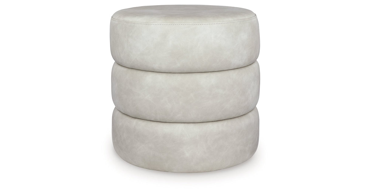 Ummi Bone Swivel Accent Ottoman by Ashley at Eve Furniture