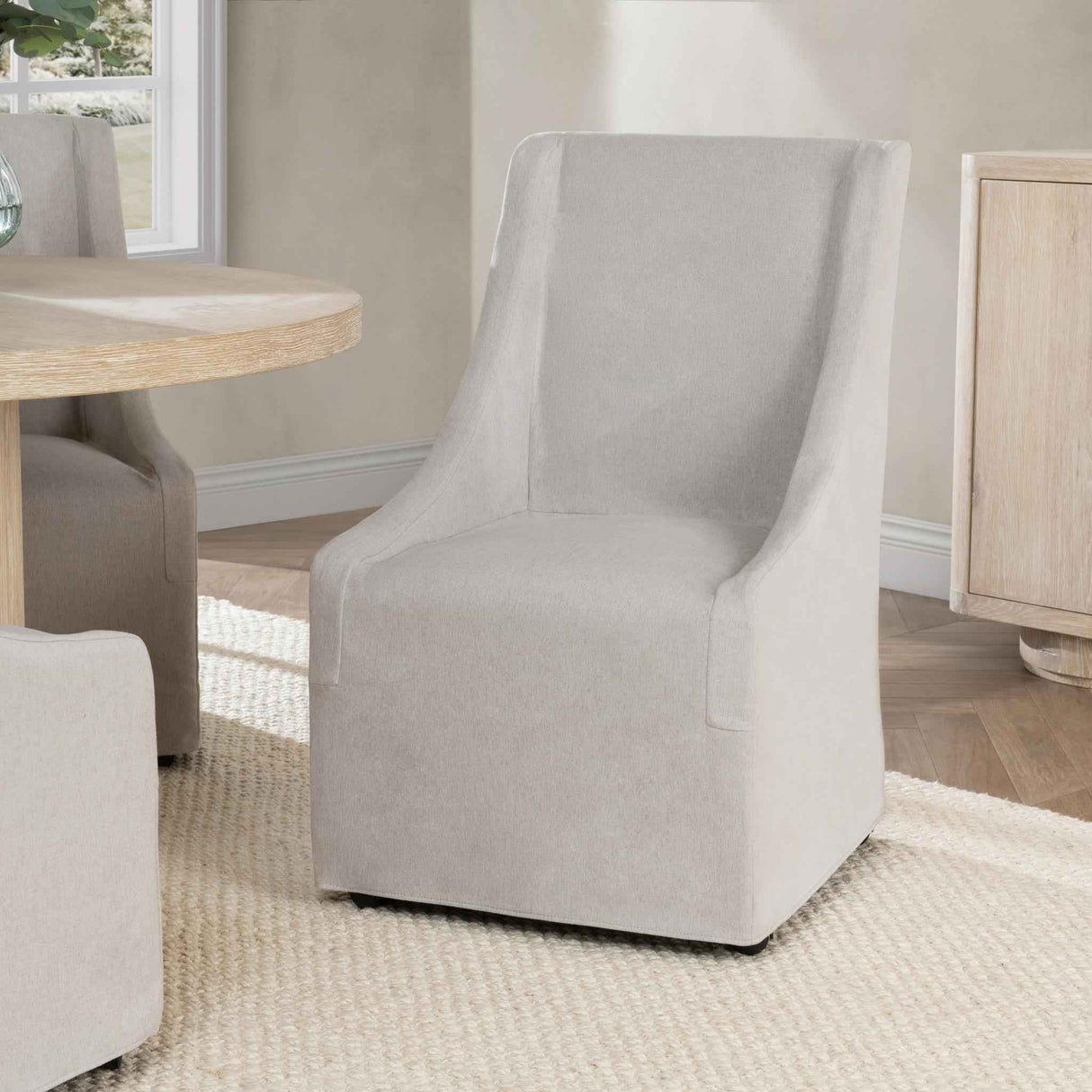 Warwick Sandy Tan Dining Chair with Casters by Classic Home at Eve Furniture