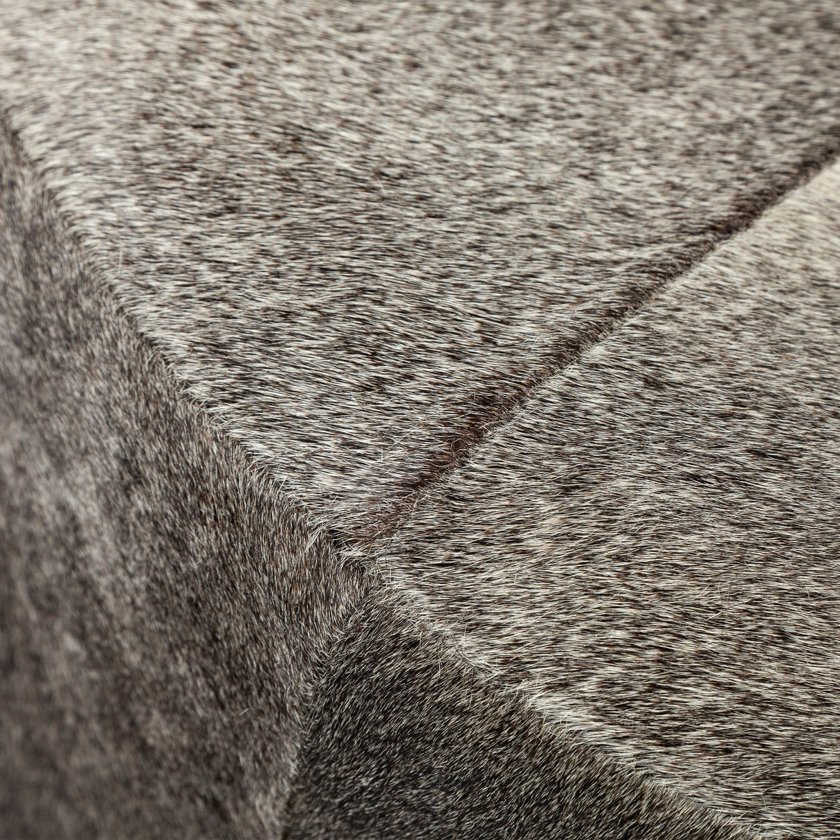 Zahavi I 23"H grey-toned hair-on-hide ottoman by Mercana at Eve Furniture