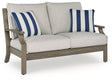 Rainier Ranch Brown/Beige Outdoor Loveseat with Cushion by Ashley at Eve Furniture