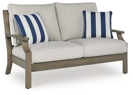 Rainier Ranch Brown/Beige Outdoor Loveseat with Cushion by Ashley at Eve Furniture