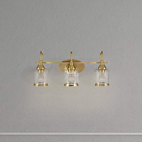 Twilight Three Lights Brushed Gold Contemporary Vanity Light 22"W × 10"H × 7.48"E with Clear Glass by Ashcroft Imports at Eve Furniture