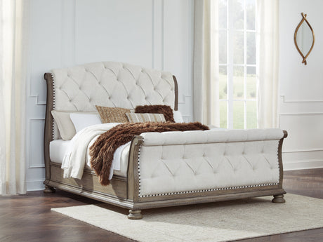Ardenfield Light Brown California King Upholstered Sleigh Bed by Ashley at Eve Furniture