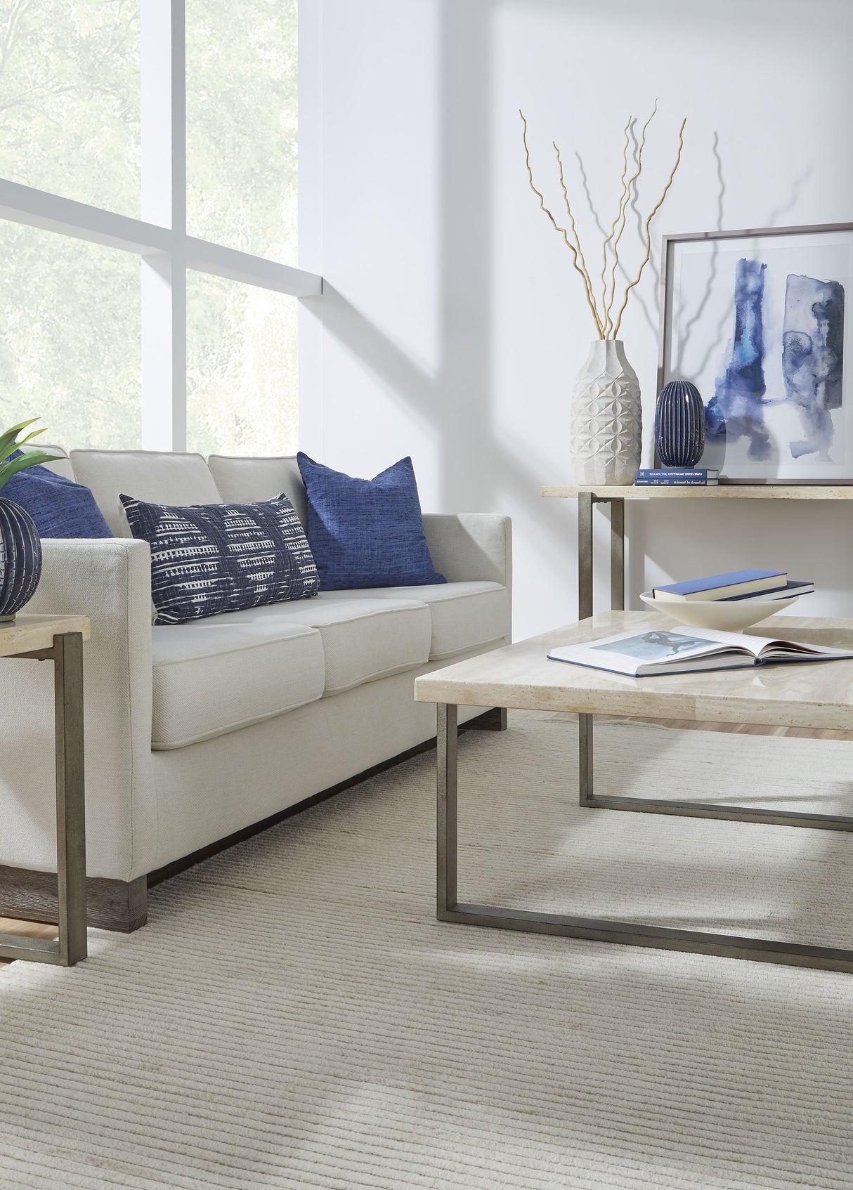 Ariela Natural Travertine Coffee Table with Bronze Metal Base by Modus Furniture at Eve Furniture