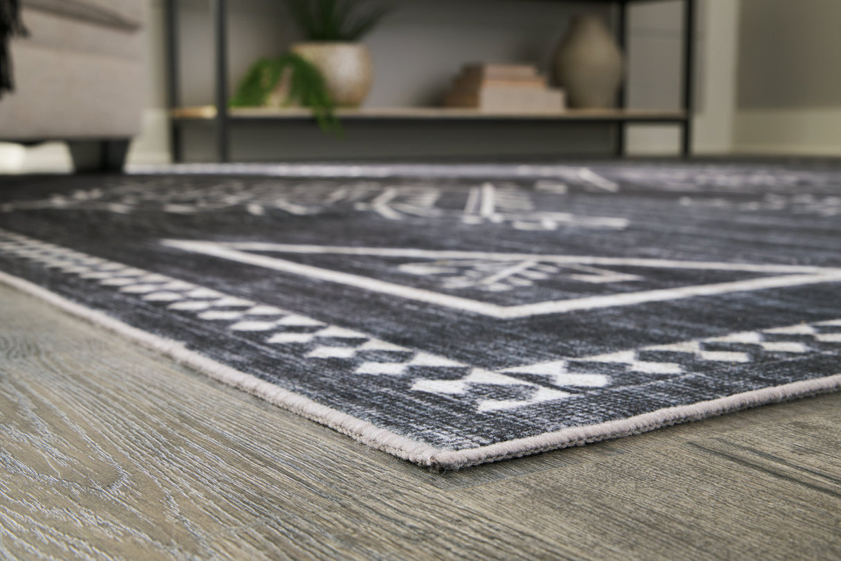 Arloman Black/Cream/Gray 5' x 7' Rug by Ashley at Eve Furniture