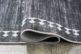 Arloman Black/Cream/Gray 5' x 7' Rug by Ashley at Eve Furniture
