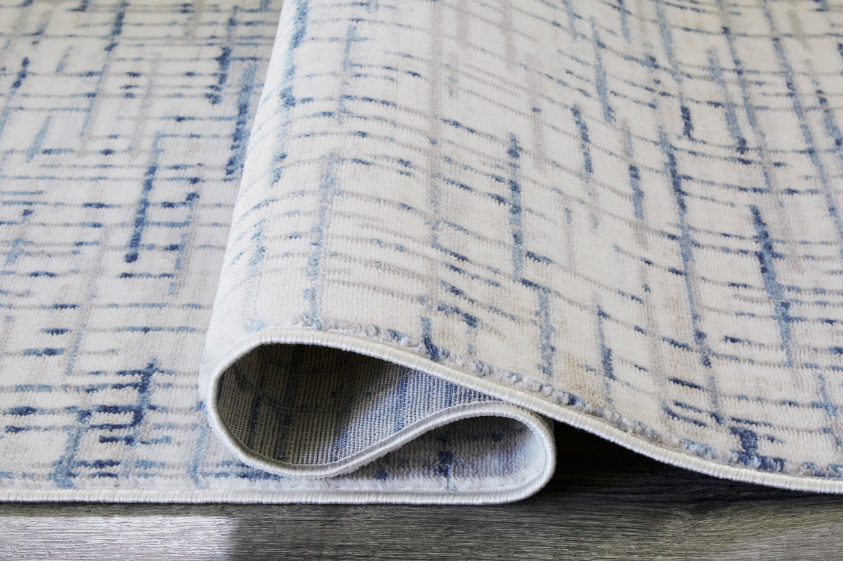 Beckfille Blue/Gray/Cream 5' x 7' Rug by Ashley at Eve Furniture