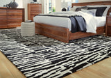 Bramshaw Black/Ivory Extra Large Rug by ASHLEY FURNITURE at Eve Furniture